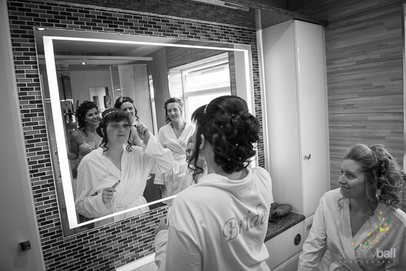 Brides gets ready in mirror